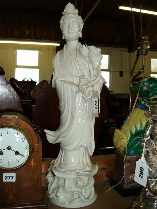 Sancai-glazed lion dog table lamp & a large blanc de chine figure of Guanyin